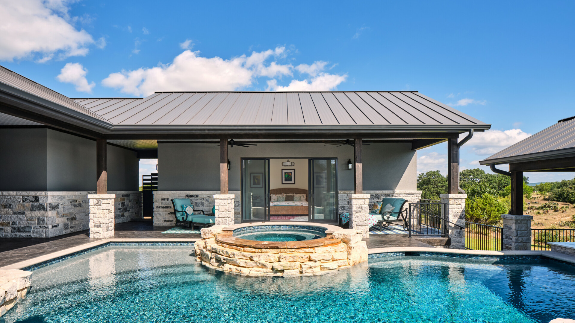 Custom lake home boasting an outdoor oasis featuring luxurious amenities, Lake LBJ TX