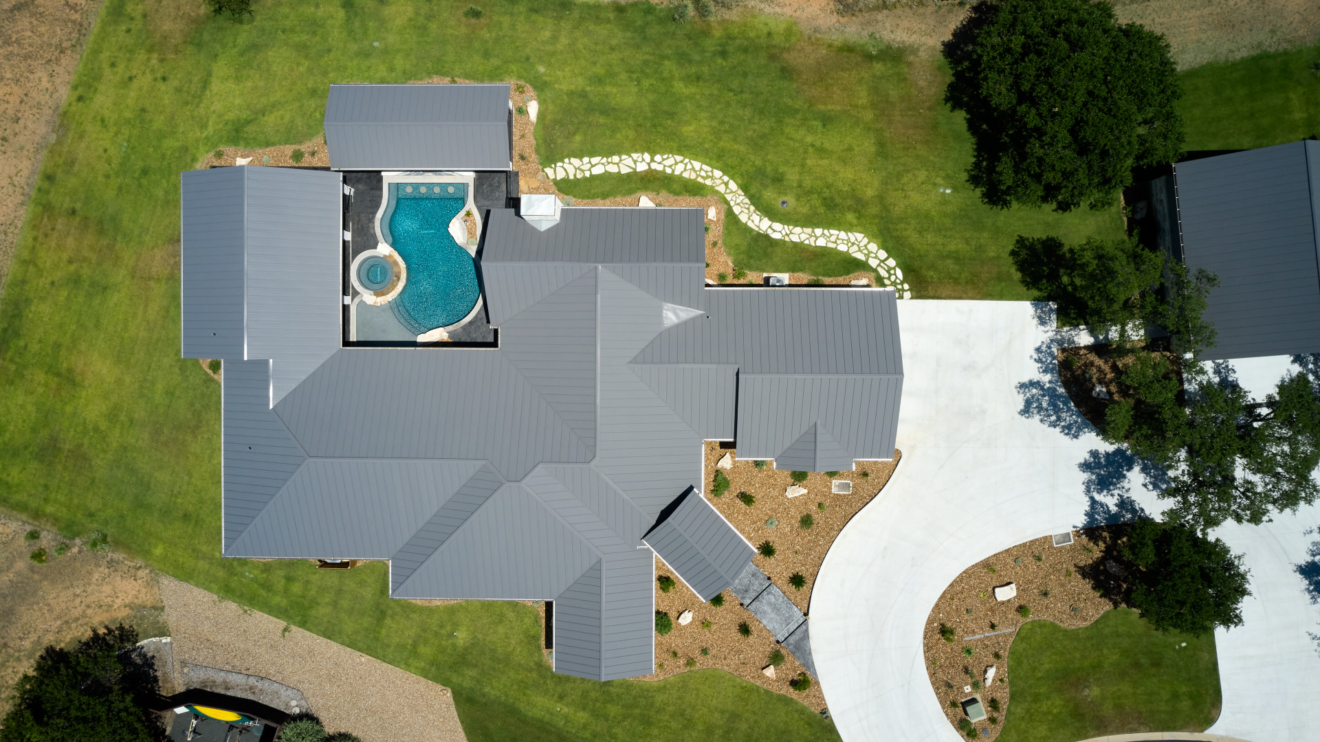 Aerial view of a custom luxury home in Lake LBJ TX